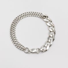 The Soho Bracelet features an 11mm sterling silver curb chain looped together with a 4.5mm sterling silver curb chain. The bracelet is 6", 7", 8", 9", or 10" long.Custom lengths available upon special request. Sterling Silver Bracelets With Chunky Chain In Oval Link, Classic Sterling Silver Chunky Chain Bracelet, Modern Sterling Silver Curb Chain Bracelet, Modern Sterling Silver Chunky Chain Bracelet, Classic Sterling Silver Cuban Link Bracelet With Silver Chain, Classic Silver Cuban Link Bracelet With Chunky Chain, Classic Sterling Silver Cuban Link Bracelet, Everyday Silver Curb Chain Bracelets, Sterling Silver Curb Chain Bracelet With Oval Links