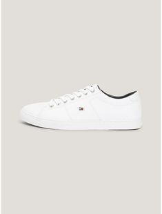 Tommy Hilfiger men's sneaker. The understated design of these low-cut leather sneakers make them the pair that goes with just about everything, Made complete with a generously padded footbed.  Material: 100% Leather (fwa). Classic Lace-up Skate Shoes With Embossed Logo, Classic Leather Lace-up Skate Shoes, Classic Leather Sneakers With Embossed Logo, Classic Leather Skate Shoes With Perforated Toe Box, Leather Low-top Skate Shoes For Everyday, White Leather Skate Shoes For Everyday, Classic Leather Skate Shoes, Classic Leather Skate Shoes With Textured Sole, Classic Low-top Skate Shoes With Embossed Logo