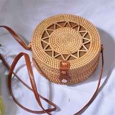 Bali Handmade Woven Rattan Bag Round Straw Shoulder Bag Women Summer New Hollow Out Retro Crossbody Bag Boho Beach Circle Bag Handmade handwoven ratta bean bags.This handcrafted bag is made with hand-harvested material and features a handle for carrying all your essentials. It's soft, lightweight, warm and has a detachable shoulder strap to keep it all together in one place! This bag also comes fully lined so you can carry all the necessities as you go about your shopping or travel. The bag carr Summer Shoulder Bag With Large Capacity, Large Capacity Summer Shoulder Bag As Gift, Eco-friendly White Crossbody Shoulder Bag, Traditional Satchel Bag For Beach, Traditional Pouch Bag For Vacation, Traditional Summer Travel Bags, Traditional Satchel Beach Bag, Traditional Travel Bags For Summer, Bohemian Beach Bag For Mobile Phone