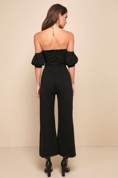 Make headlines in the style section with the Lulus Impress Release Black Off-the-Shoulder Puff Sleeve Jumpsuit! Medium-weight, stretchy crepe knit creates an off-the-shoulder neckline (with hidden no-slip strips), a ruched bodice, and short puff sleeves with elastic at the shoulders and banded cuffs. High waist sits above cropped wide pant legs. Hidden back zipper. Fit: This garment fits true to size. Length: Ankle length. Size medium measures 47.75" from shoulder to hem. Inseam: 25.50 Front Ris Fitted Solid Color Jumpsuits And Rompers With Puff Sleeves, Chic Off-shoulder Jumpsuits And Rompers In Solid Color, Chic Off-shoulder Solid Jumpsuit, Chic Off-shoulder Solid Jumpsuits And Rompers, Chic Solid Color Off-shoulder Jumpsuit, Chic Off-shoulder Jumpsuit, Chic Fitted Off-shoulder Top With Elastic Shoulders, Fitted Off-shoulder Top With Elastic Shoulders, Chic Solid Color Off-shoulder Top For Party