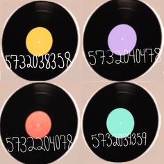 four different colored discs with numbers on them