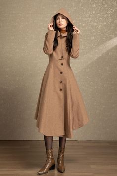 ★★ Welcome to Ylistyle Handmade shop Long camel hooded wool coat, made of high-quality fabric, giving you a good touch and very comfortable to wear. Can be customized to your size. The hooded adopts a unique design, which adds a highlight and makes the coat look more refined. ★★ FEATURES 30% wool, 70% other fiber,nylon, soft and thicker wool fabric for the coming winter Polyester lining Two side pockets Buttons closure Long sleeves Hooded wool coat Camel coat Asymmetrical hem Perfect for winter, autumn Dry clean ★★ The model's height approx 170 cm (5′ 7″) with the 84 cm (33") bust, 66 cm (26") waist. She is wearing the wool coat in size XS (US2) ★★Bespoke Order Service Request other color Request the Length Request the sleeve length Your height is not between 155cm- 175cm Your weight is no Long Sleeve Beige Wool Coat For Fall, Long Beige Sweater Coat For Winter, Beige Long Sleeve Wool Coat For Winter, Beige Long Sweater Coat For Winter, Brown Hooded Wool Coat For Winter, Hooded Wool Coat With Buttons For Fall, Beige Wool Coat With Stand Collar For Winter, Asymmetrical Single Breasted Outerwear For Fall, Asymmetrical Single Breasted Fall Outerwear