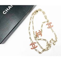 Chanel Gold CC Red Bead Chain Necklace  *Marked 08 *Made in Italy *Comes with original box  -Approximately 40″ long total -Pendants are approximately 1″ x 1″. -Wrap around double or wear as a long necklace. -In an excellent condition.  AB8008-00179  Please see the measurements section for best approximate dimensions. Designer Chain Necklace As Gift, Designer Chain Necklace For Gift, Red Long Necklace With Adjustable Chain, Elegant Red Beaded Chain Necklace, Designer Red Jewelry Gift, Designer Red Jewelry As Gift, Luxury Red Necklaces, Designer Red Jewelry For Gift, Elegant Red Long Necklace For Gift