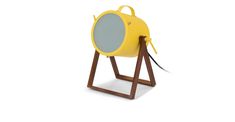 a yellow light sitting on top of a wooden stand in front of a white background