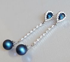 Navy Blue Dark Blue Iridescent Pearl CZ Silver Long Dangle Wedding Bridal Earrings.  PLEASE READ ITEM DESCRIPTION and SHOP POLICIES before placing your order, and contact me with any questions! EARRINGS are about 1.77 inch (4.5cm) long from top of earring stud to bottom. Pearls are 8mm. BRIDAL EARRINGS SECTION: https://www.etsy.com/shop/LanaChayka?ref=seller-platform-mcnav§ion_id=11638940 BRIDAL JEWELRY SETS SECTION: https://www.etsy.com/shop/LanaChayka?ref=seller-platform-mcnav§ion_id=25839214 Luxury Blue Pearl Earrings For Pierced Ears, Blue Dangle Bridal Earrings For Formal Occasions, Formal Blue Dangle Bridal Earrings, Blue Drop Bridal Earrings For Formal Events, Blue Drop Bridal Earrings For Formal Occasions, Blue Drop Bridal Earrings For Party, Blue Teardrop Pearl Earrings For Formal Occasions, Blue Teardrop Pearl Earrings For Wedding, Blue Pearl Drop Earrings For Party