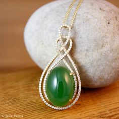 "Here is a beautiful translucent large oval green nephrite jade pendant set with pave diamonds in solid 18KT yellow gold. The jade is set in a double infinity love knott halo setting and is surrounded by pave set round diamonds. The jade is about 14x18mm and is approx. 14.45 carats. The total weight of the brilliant cut round white diamonds is 0.49 carats. The pendant is about 1 1/2\" long. The chain is 14KT gold and is 16\" long. If you do not want the chain, please convo us and we will adjust Elegant Oval Jade Jewelry, Elegant Oval Cabochon Jade Jewelry, Infinity Love, Lucky Green, Halo Setting, Halo Pendant, Nephrite Jade, Jade Pendant, Green Jade