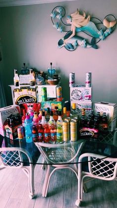 a glass table topped with lots of bottles and condiments on top of it