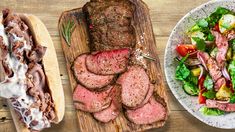 three different types of meats and salads on plates next to breaded buns