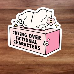 a sticker that says crying over fictional characters on it's pink box