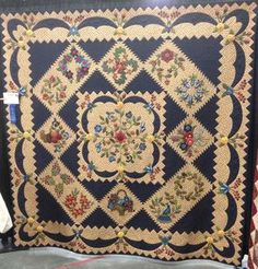 an antique quilt on display in a store