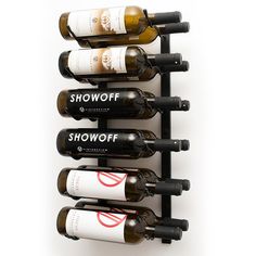 several bottles of wine are lined up on a wall mounted rack with the words showoff written on them