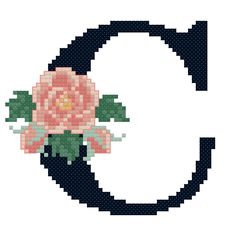 the letter q with a pink flower on it