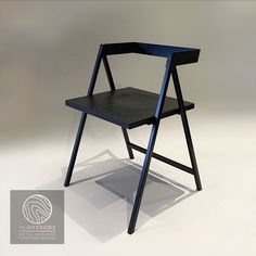 a black chair sitting on top of a white floor