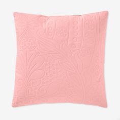 a pink pillow with an intricate design on the front and back, it is made out of