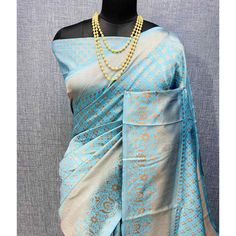 Light Blue colored saree is made from banarasi silk fabric which is highlighted with beautiful weaving work as shown. Comes along with unstitched banarasi silk blouse piece which you can customise as per your design/style. Occasion - You can wear this saree for festivals and functions. Note:- the actual product may differ slightly in color and design from the one illustrated in the images when compared with computer or mobile screen. Measurements: Saree : Banarasi Silk : 5.5 Mtrs Blouse : Banarasi Silk : 0.8 Mtr Material: Banarasi Silk Stitch Type: Unstitched Country of Origin: India Care Guide: Dry Clean Blue Slub Silk Pre-draped Saree With Unstitched Blouse, Elegant Blue Pre-draped Saree For Puja, Blue Slub Silk Traditional Bollywood Wear, Blue Slub Silk Pre-draped Saree With Self Design, Blue Slub Silk Blouse With Zari Weaving, Blue Jamawar Pre-draped Saree With Zari Weaving, Elegant Blue Slub Silk Saree, Blue Katan Silk Pre-draped Saree With Zari Work, Blue Slub Silk Saree For Festivals