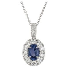 Beautiful sapphire and diamond pedant necklace. FGL Certified 3.04 carat oval blue natural no heat sapphire mounted in an 18k white gold setting with a halo of round brilliant cut diamonds, accented with diamonds along the bail with a total carat weight of 1.98cts. Designed and crafted in the Peter Suchy Workshop. 1 oval blue sapphire, VS approx. 3.04cts, FGL Certificate # FL5-7850120 14 round brilliant cut diamonds, G VS approx. 1.98cts 18k white gold Stamped: 18k 750 7.8 grams Top to bottom: 26.3mm or 1 Inch finch Width: 14.0mm or .55 Inches Depth or thickness: 5.5mm Chain: 18 Inches Width: 1.5mm Please Note, we photograph each item as accurately as possible. However due to monitor/mobile device resolution and calibration, we understand some photos may vary in appearance. If you are not Diamond Gold Pendant, White Gold Set, No Heat, Diamond Gold, Gold Pendant Necklace, Sapphire Diamond, Round Brilliant Cut Diamond, Ring Verlobung, Gold Pendant