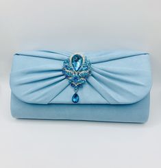 Stunning Baby Blue Powder Blue Dusty Dusky Blue Crystal and Diamanté Embellished Bridal Wedding Clutch Bag with Silver Chain Soft Suede Style Finish Very Elegant Perfect Wedding Day Clutch Bag  Size Approx. 27cm x 14cm x 7cm Co-ordinating shoes also available Blue Rhinestone Clutch For Party, Embellished Blue Party Clutch, Blue Evening Bag With Rhinestones, Blue Rhinestone Evening Bag, Blue Rhinestone Evening Bag For Weddings, Blue Rhinestone Evening Bag For Party, Blue Embellished Party Clutch, Elegant Light Blue Clutch For Evening, Elegant Light Blue Evening Clutch