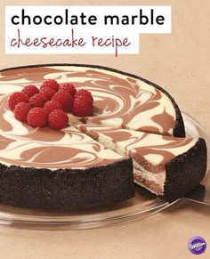 a chocolate marble cheesecake with raspberries on top and the words, chocolate marble cheesecake recipe