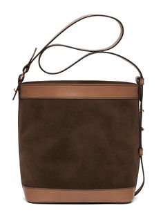 a brown and tan handbag is shown on a white background with the strap down