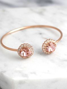 Blush Bracelet, Morganite Bridal Bracelet, Bridal Rose Gold Bracelet, Bangle Gold Bridal Bracelet, Bridesmaids Gifts, Dusty Pink Bracelet  Petite Delights is an Official SWAROVSKI® Branding Partner Official Swarovski Elements® Partner Made with real genuine high quality Austrian Swarovski ©Crystal . Our brand is legally licensed & authorized By Swarovski Company for high quality manufacturing. This pair comes with Swarovski genuine tag , this is unique to our store . They serve as a sign ... Delicate Round Bracelets For Party, Elegant Bangle Bracelets For Bridesmaid Gift, Rose Gold Jubilee Cuff Bracelet For Wedding, Rose Gold Jubilee Bracelet For Wedding, Adjustable Rose Gold Crystal Bangle Bracelet, Delicate Pink Bracelets For Wedding, Delicate Pink Bracelet For Wedding, Pink Bangle Cuff Bracelet For Wedding, Delicate Rose Gold Bracelets For Bridesmaids