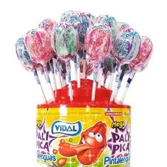 a can filled with lollipops sitting on top of each other