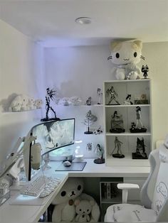 a white desk topped with lots of stuffed animals