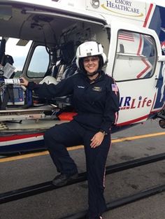 a woman sitting in front of a helicopter with the caption that reads, interested in a career change? consider becoming a flight nurse