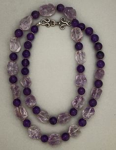 One-of-a-kind statement necklace handcrafted in Tubac, Arizona. Beads : hammered Brazilian amethyst, polished amethyst, sterling silver. Dimensions: approximately 36". This necklace can be worn doubled. Make a Statement with this versatile necklace! ﻿Free Shipping ﻿Refund Policy Silver Single Strand Amethyst Necklace, Silver Amethyst Single Strand Necklace, Silver Amethyst Necklace With Single Strand, Double Strand Amethyst Gemstone Beads Jewelry, Amethyst Double Strand For Jewelry Making, Double Strand Purple Jewelry With Natural Stones, Purple Double Strand Jewelry With Natural Stones, Purple Double Strand Natural Stones Jewelry, Tubac Arizona