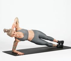 a woman is doing an exercise on a yoga mat with her leg up in the air