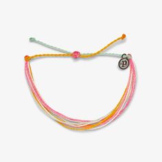 Introducing Brighter Days, the bracelet that ignites memories of vibrant sunsets. Handcrafted with hues of pink, orange, and yellow, each piece embodies the warmth and beauty of golden hour. Waterproof and meticulously crafted, it gains character with every wear, reflecting the ever-changing beauty of nature. Embrace the uplifting energy of Pura Vida by securing yours today and let your style shine as brightly as the sun. Pur Vida Bracelet, Ours Vida Bracelets, Pura Vida Bracelet Color Combos, Puts Vida Bracelets, Pita Vida Bracelets, Puravida Bracelets, Pura Vida Jewelry, Preppy Jewelry, Brighter Days