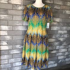 Lularoe Amelia Dress Size 2xl Yellow Green Blue Color Armpit To Armpit 20” Waist 17.5” Length 42” Nwt Yellow Stretch Short Sleeve Midi Dress, Yellow Short Sleeve Stretch Midi Dress, Aztec Shorts, Georgia Dress, Short Sleeve Floral Dress, Black Skater Dress, Lularoe Amelia Dress, Lularoe Amelia, Lularoe Julia Dress