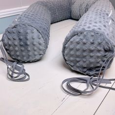 a large gray object sitting on top of a white table next to a corded phone