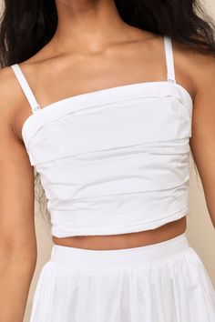 From errands to casual dates and everywhere in between, we love the Lulus Daytime Perfection White Cotton Pleated Cropped Sleeveless Top! Lightweight woven poplin shapes adjustable spaghetti straps (with detachable hooks for a convertible, strapless look) that support a sleeveless bodice with an irregular textured of folded pleats. Straight neckline and cropped hem give this top and ultra-wearable design! Smocked panel at back for fit. Pair with the matching skirt for a complete look! Fit: This Summer Tube Top With Built-in Bra And Tank Straps, Casual Strapless Camisole With Built-in Bra, Chic Summer Top With Removable Straps, Chic Summer Tops With Removable Straps, Summer Strapless Vest Top, Strapless Vest Top For Summer, Trendy Spring Tube Top With Adjustable Straps, Trendy Tube Top With Adjustable Straps For Spring, Trendy Strapless Cotton Tank Top