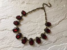 "Victorian shaped antiqued brass red glass stones necklace design just perfect to wear on your wedding day! We have added an extra long cable chain for you to adjust the length. Color: antiqued brass with red rhinestones crystals and glass stones Size: sparkle part measures around 15\" long x 0.9\" width Item ship out with tracking number to you (around 10 to 14 business days for delivery). We also provide fast shipping service, around 3-4 business days delivery but need to add extra charge. Ple Vintage Red Garnet Necklace, Antique Red Necklace For Wedding, Antique Red Garnet Necklace, Red Garnet Necklace, Ruby Wedding, Garnet Necklace, Red Necklace, Pretty Rocks, Wedding Bridal Jewellery