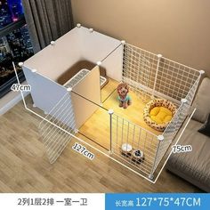 a dog is sitting in its cage next to the couch and television screen with measurements