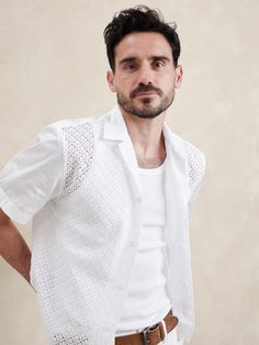 Our take on the season's reinvented heirlooms trend, we cut this relaxed resort shirt front from a corded fabric with a lace-like open weave.  For the sleeves and back panel, we reached for our signature cotton twill.  Standard fit.  Resort collar with button-front closure.  Straight hem with side vents.  Standard fit.  Short sleeves.  Hip length.  Model: Size M, 6'2" (188cm). Latin Men Outfit, Resort Shirt Men, Shirt Men Outfit, Summer Cafe, Rich Style, Latin Men, Resort Shirt, White Shirt Men, Summer Is Coming