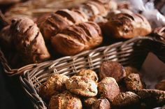 breads and pastries in wicker baskets on display