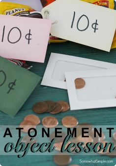 some money sitting on top of a table with the words atonement object lessons