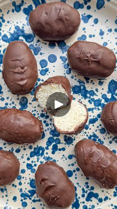 chocolate covered donuts on a blue and white plate