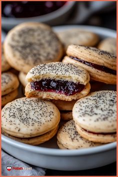 a plate full of cookies with jam on them