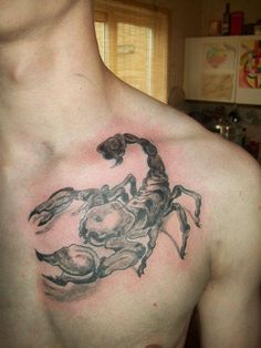 a man with a scorpion tattoo on his chest