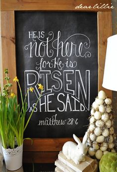 a chalkboard sign that says, he is not here for he is risen as he said