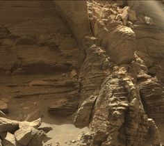 an aerial view of rocks and sand in the desert, taken by nasa's curiosity