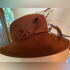 Special Occasion And Event Hat. Italian Styled In Coffee Brown With Felt Hatband And Feather Accents. Fitted Brown Brimmed Top Hat, Brown Fitted Fedora For Kentucky Derby, Fitted Brown Top Hat With Short Brim, Short Brim Hat For Kentucky Derby, Fitted Fall Hat With Short Brim, Fitted Short Brim Hat For Fall, Fitted Brown Hat For Kentucky Derby, Fitted Brown Top Hat With Flat Brim, Brown Fitted Top Hat With Flat Brim