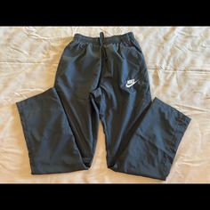 New Without Tags Nike Track Pants. Unisex. Side Pockets And One Back Pocket. Never Been Worn. Measurements In Pictures. Nike Bottoms With Elastic Waistband, Urban Nike Pants With Pockets, Nike Full-length Bottoms With Pockets, Nike Navy Track Pants, Nike Cargo Pants With Pockets, Sportswear Style, Nike Blue Vintage Track Pants, Nike Track Pants, Nike Pants, Track Pants