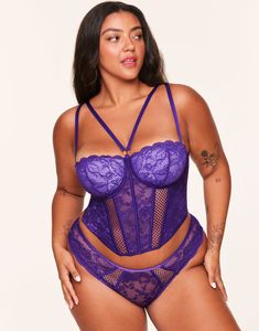 Get bold with the Dominika corset—it features gorgeous lace balconette cups, supportive underwire, sexy straps connected with a gold ring in the front, and adjustable straps for the perfect fit. Finish off the look with the matching high-leg cheeky panty. (Available in plus-sizes 38DD-46DDD.) Indigo Purple, Mary Jane Shoes Womens, Bodysuit Lingerie, Sneaker Dress Shoes, Adore Me, Medium Purple, Bustier Top, Women Lace, Denim Shop