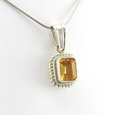 This rectangle cut genuine citrine gemstone is set in sterling silver in Nepal. Handmade garnet pendant is 1 inches long and 1/2 inch wide and is sold separate from the snake chain shown. To clean pendant: simply use a jewelry polishing cloth to brighten the silver. Style Number: 18440 Metal: 925 Sterling Silver Gemstone: Genuine Citrine Dimensions: 1 inch long and 1/2 inch wide Handmade in Nepal Silver Topaz Jewelry With Rectangular Stone, Silver Rectangular Topaz Jewelry, Rectangular Yellow Gemstone Jewelry, Yellow Rectangular Gemstone Jewelry, Rectangular Silver Topaz Jewelry, Rectangular Citrine Jewelry For Anniversary, Classic Rectangular Topaz Jewelry, Sterling Silver Jewelry With Faceted Rectangular Stone, Classic Citrine Rectangular Jewelry