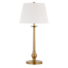 a gold lamp with a white shade on it