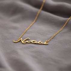 Mon Petit Name Necklace - Gold Plated | Oak & Luna Elegant Gold Name Necklace With Cable Chain, Gold Name Necklace With Cable Chain As Gift, Gold Name Necklace With Cable Chain For Gift, Elegant Everyday Name Necklace With Cable Chain, Elegant Everyday Tarnish Resistant Name Necklace, Gold Name Necklace With Cable Chain, Everyday Signature Gold Jewelry, Gold Nameplate Necklace, Nameplate Necklace Gold