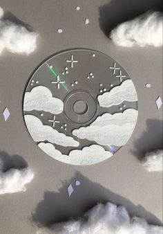 a cd cover with clouds and stars in the sky as if it were made out of paper